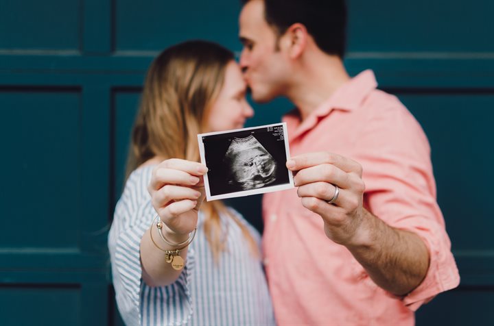 Couple with a baby scan picture