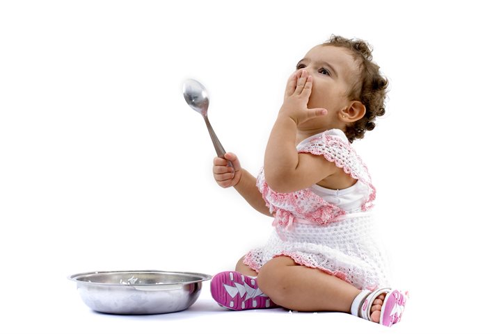Toddler with a bowl and spoon