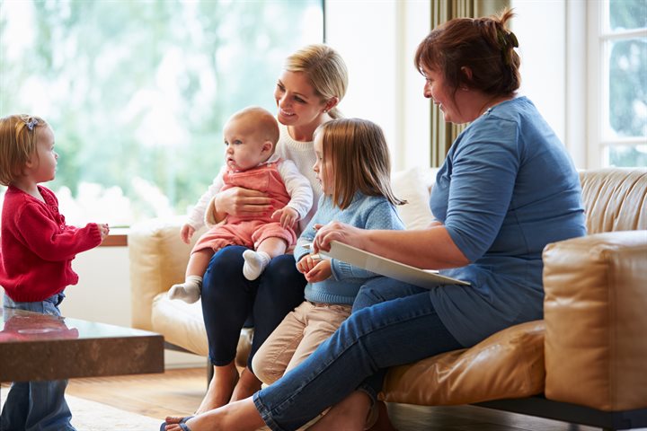 Health visitor talking to family