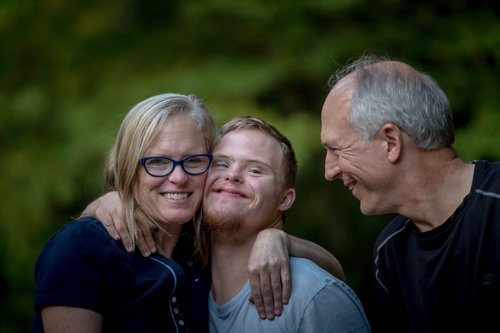 Parents and son with downs syndrome